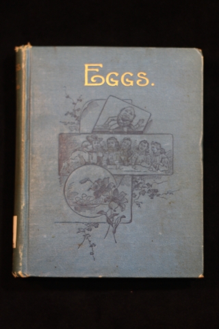Blue cover of Eggs: facts and fancies about them with drawings of people and flowers; short title "Eggs" is in gold lettering.