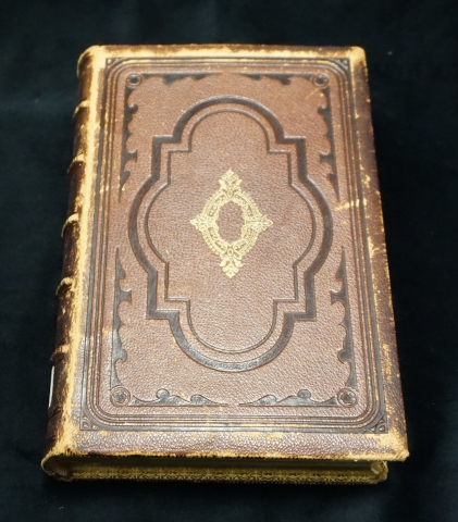 Gilt, embossed cover of A Grandfather's Legacy.