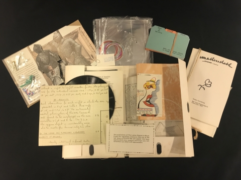 S.M.S., no. 6, open portfolio with object laid out