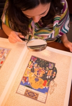 Researcher studying Arabic manuscript