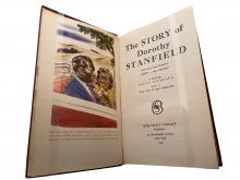 Book open to title page with color illustration on the facing page