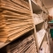 Woman browsing and reading newspaper stacks