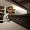 Rare book librarian shelving large books